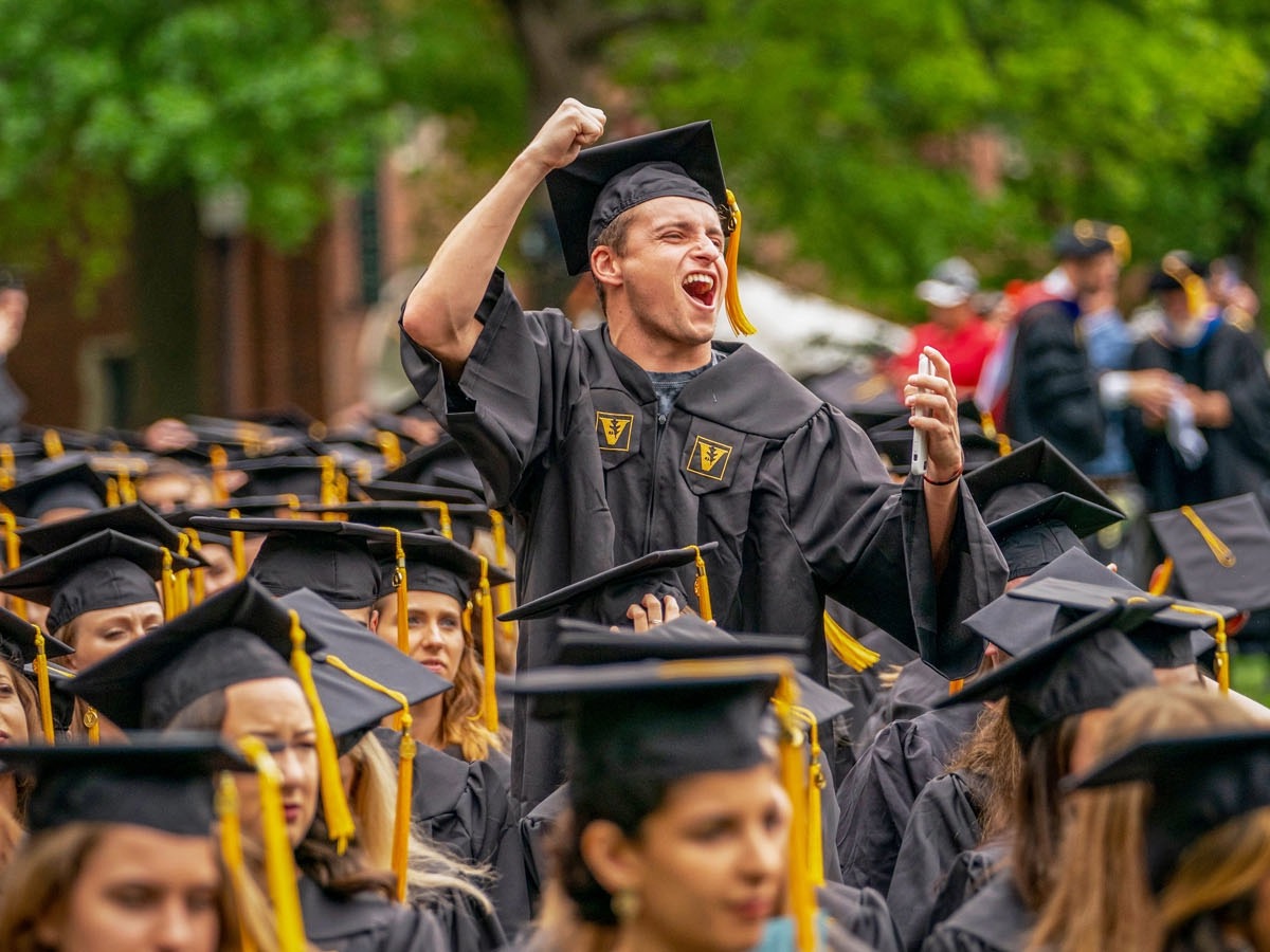 Graduate celebrating at graduation