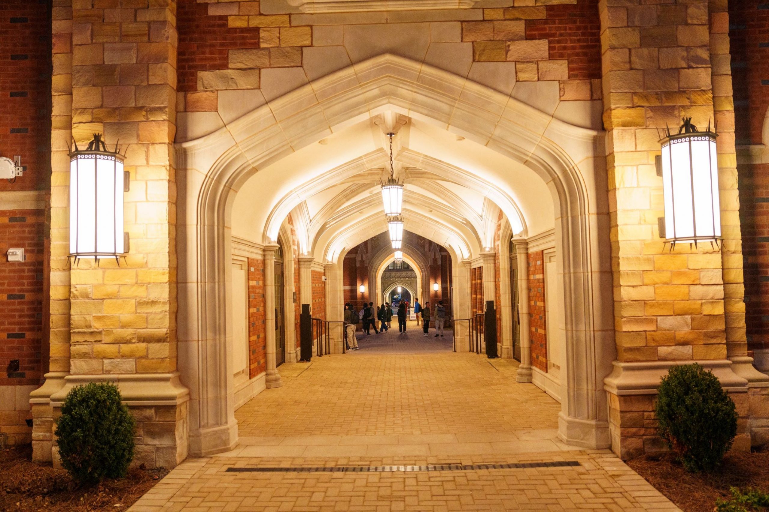 three students walking on campus