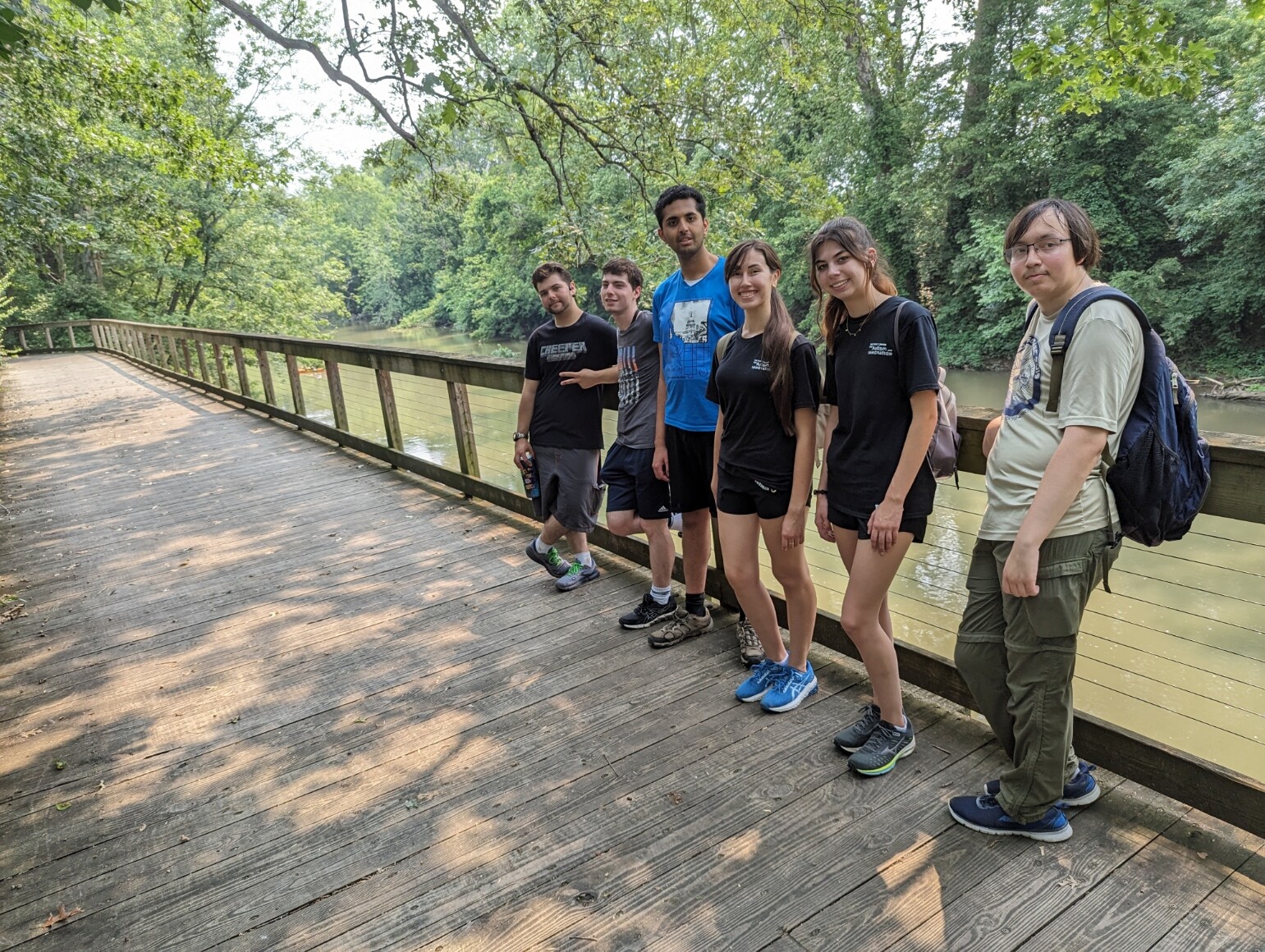 FCAI Autism Summer Interns 2023 pose by a river during their stay in Nashville for the summer.
