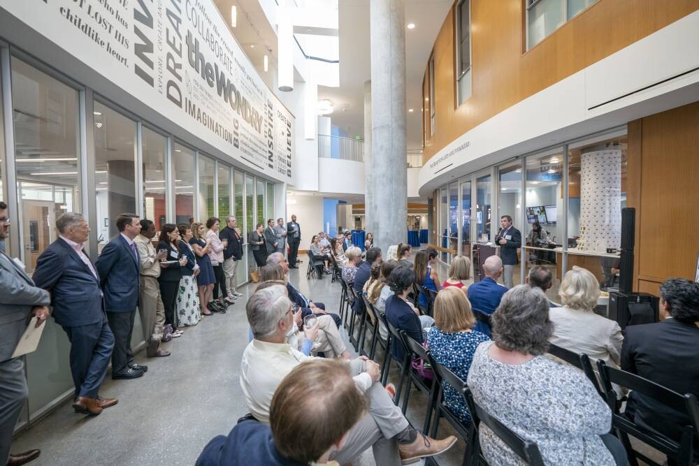 Attendees at the grand opening of the Frist Center for Autism and Innovation watch speeches given by leadership.