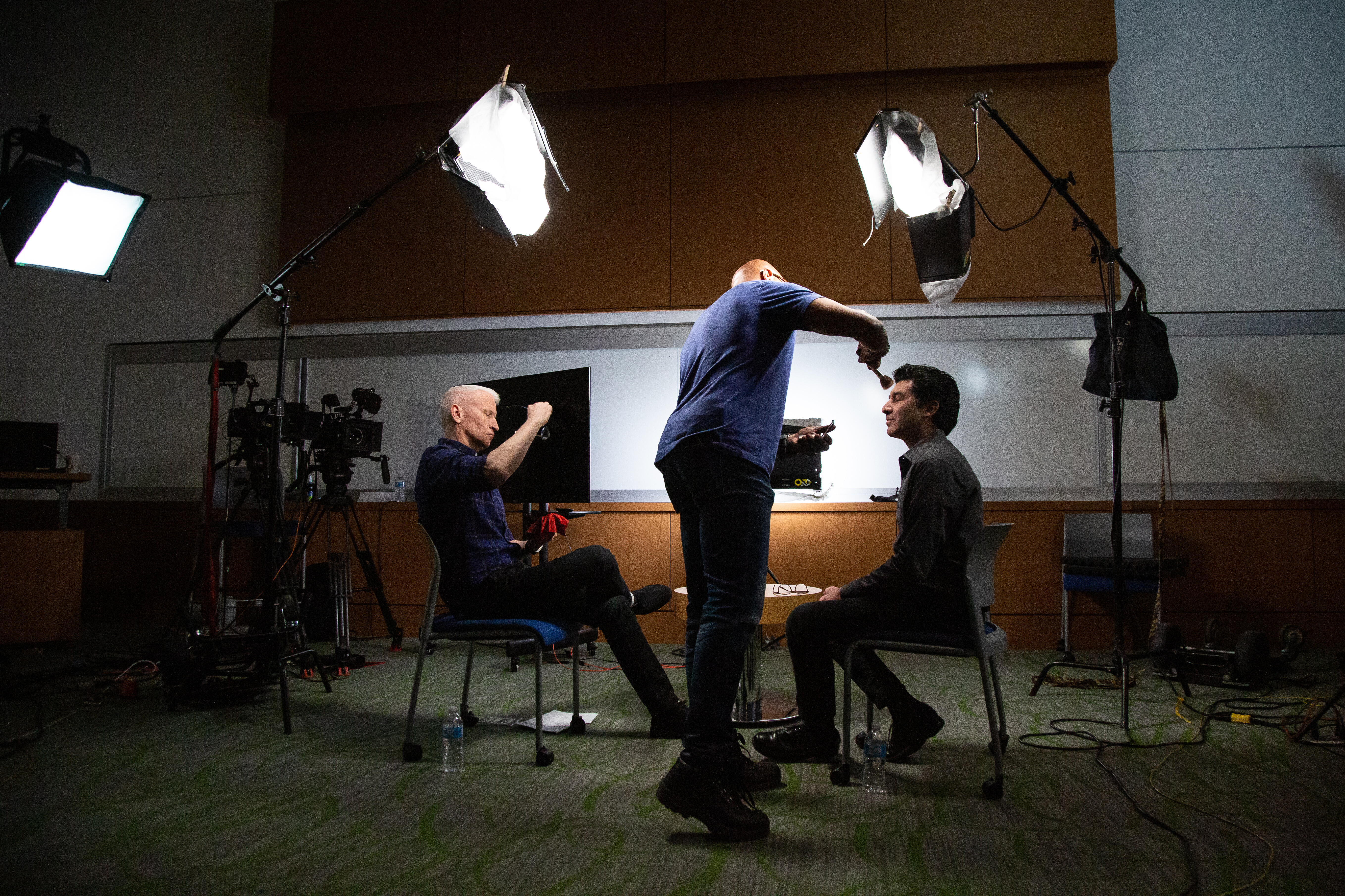 FCAI Director Keivan Stassun and Anderson Cooper prepare for filming a segment on the Frist Center for Autism and Innovation for 60 minutes.