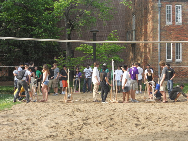 Ranks of trebuchets prepare to fire.