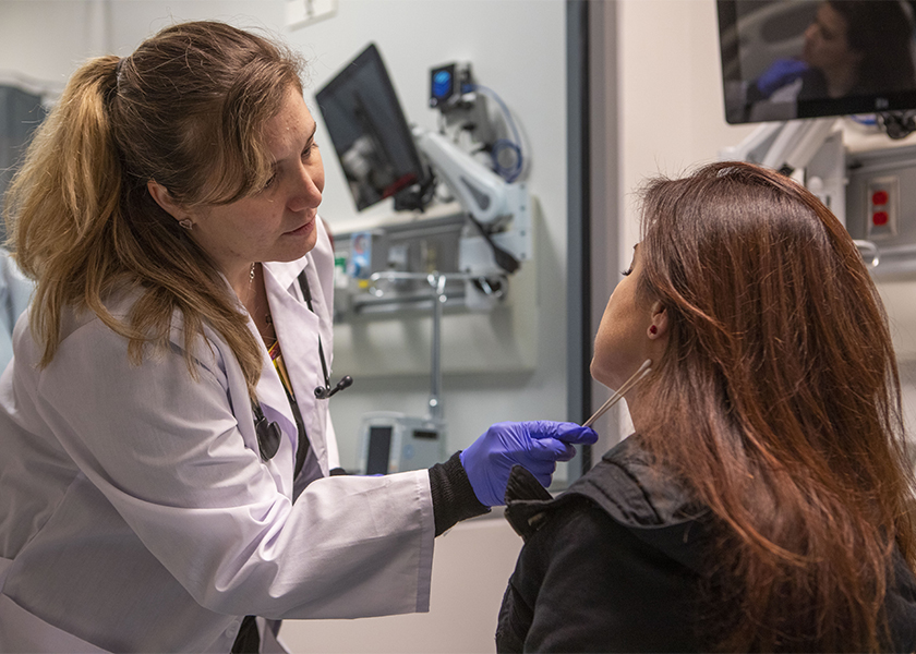 Vanderbilt SANE student Michelle Currey collects evidence with a swab.