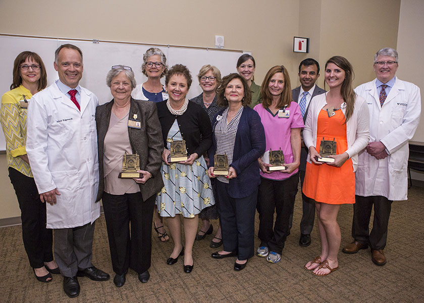 Group of VUSN faculty and staff with VUMC doctor and CEOs