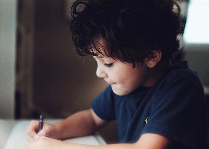 Little boy drawing a picture