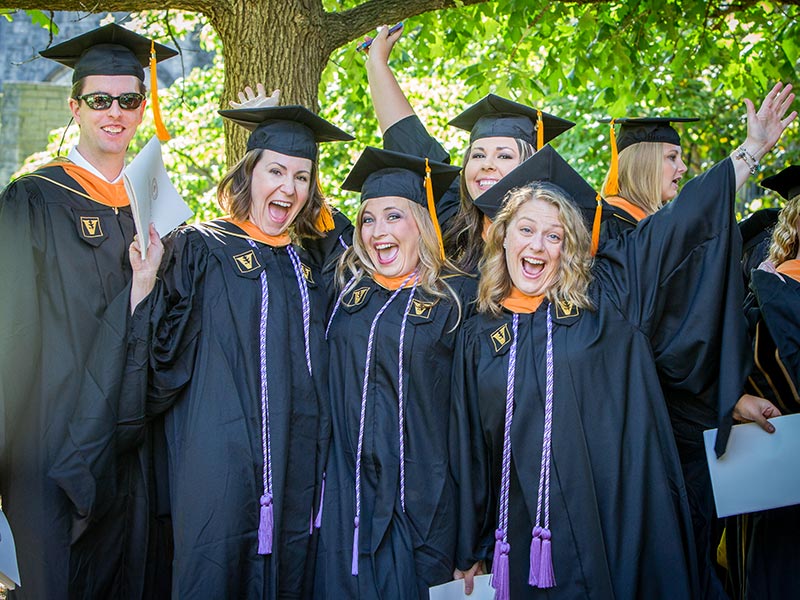 Justin Ellison, Erica May, Joanna Jhant, Rachael Sweeney and Mindy Johnson celebrate at the School of Nursing ceremony. (photo by Susan Urmy)