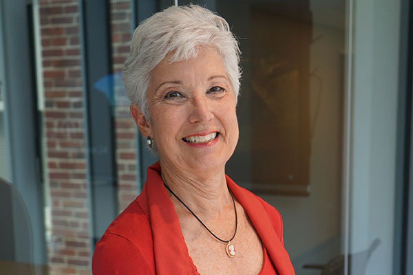 Vanderbilt professor Susie Adams standing in front of a window