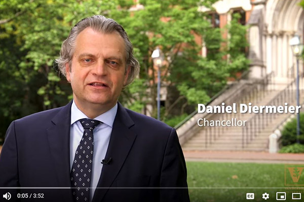 Vanderbilt Chancellor Daniel Diermeier standing in front of historic Kirkland Hall