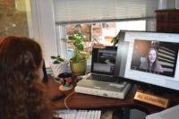 Patient talks to nurse practitioner via computer from home using telehealth