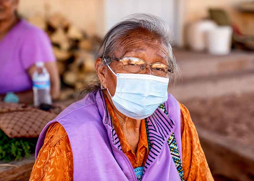 Older Navajo woman wearing a mask to avoid COVID