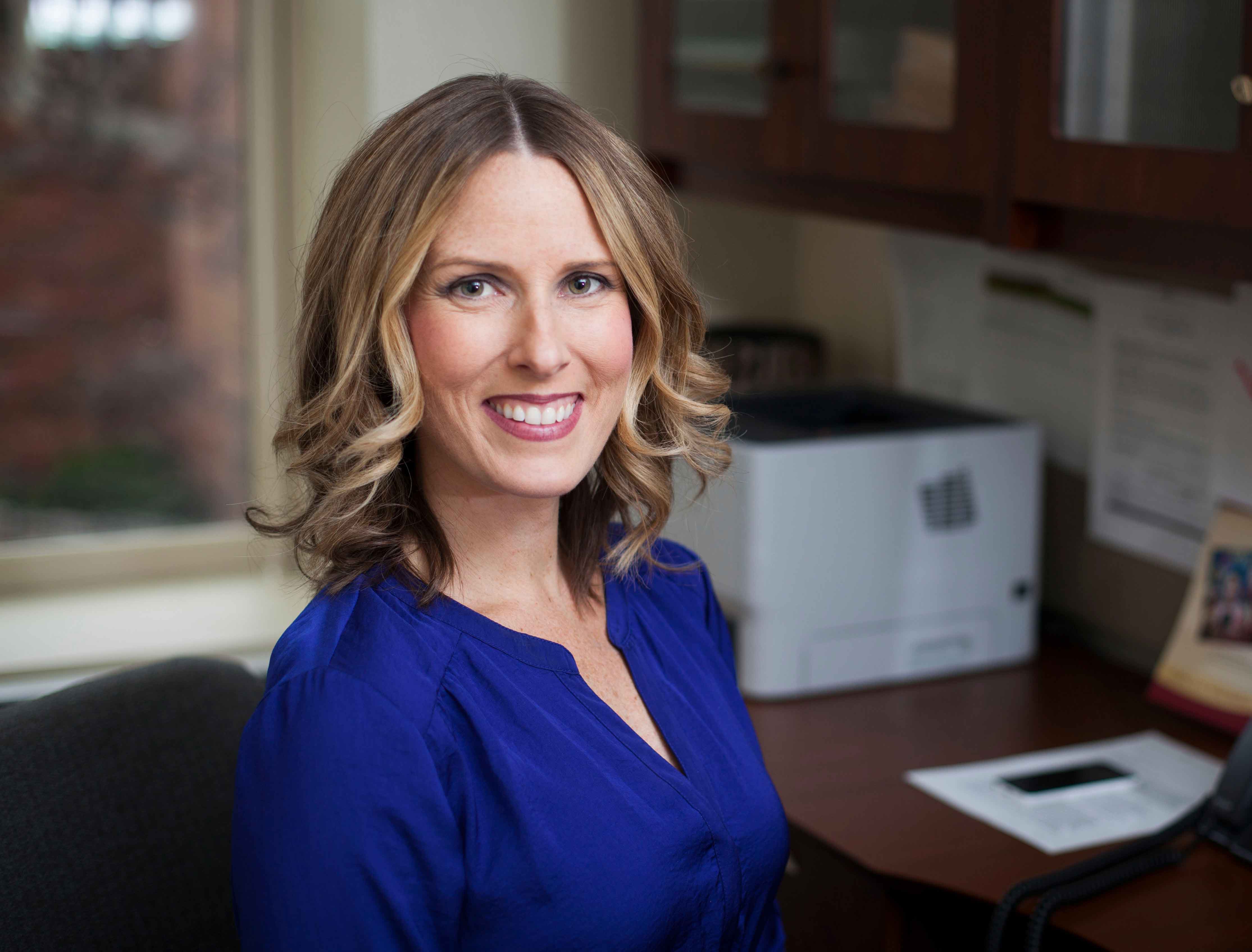 New head of PhD program Terrah Akard at her desk