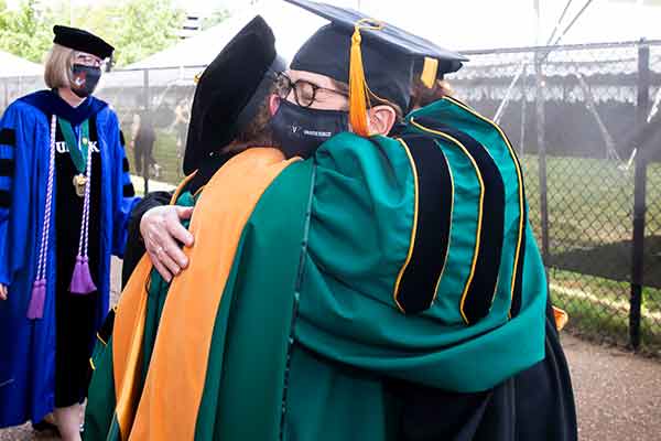 Linda Norman and Marilyn Dubree hug