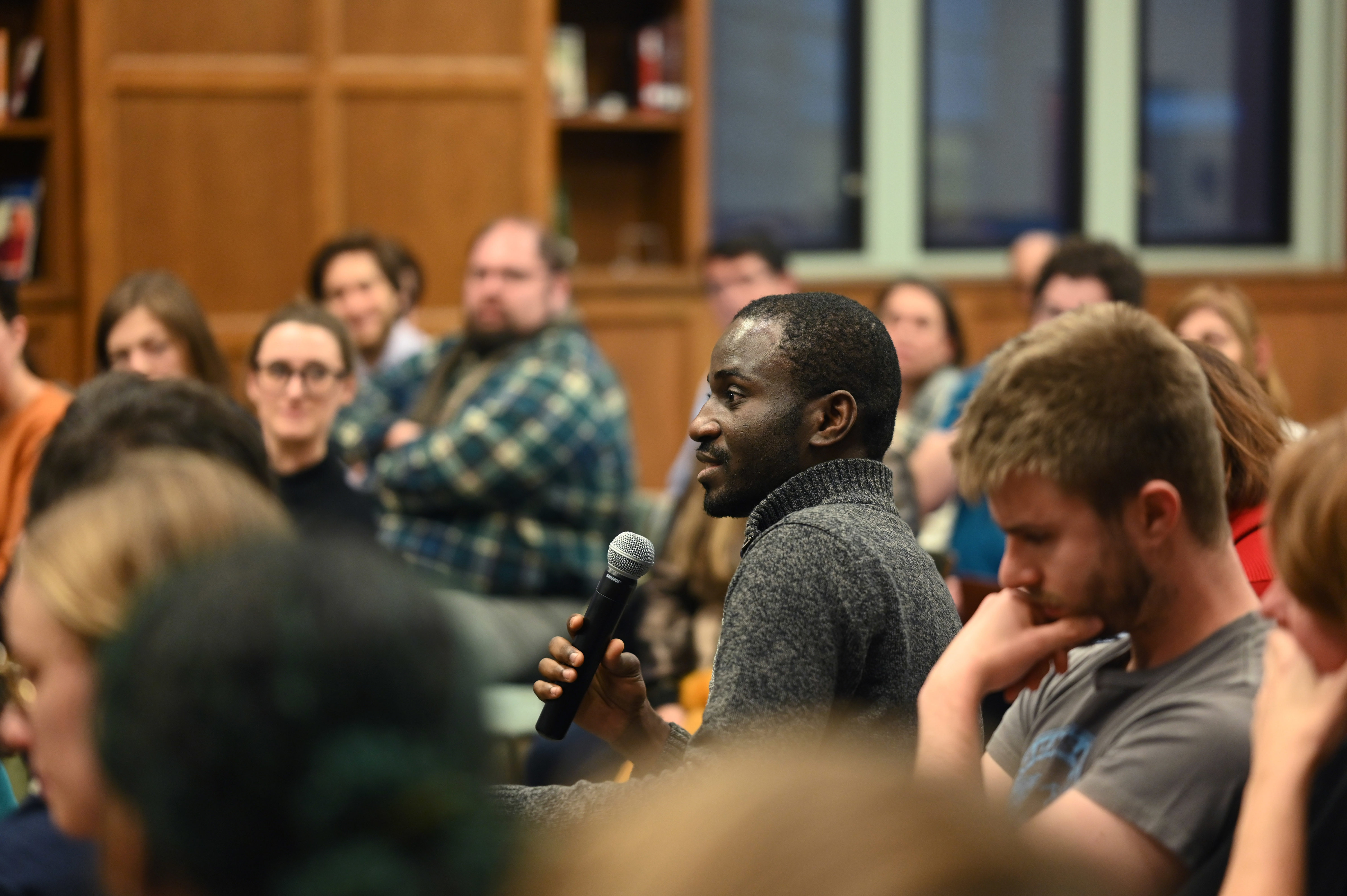 audience member asking a question at end of panel session