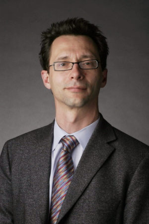 photo of Jonathan Gilligan against a gray background