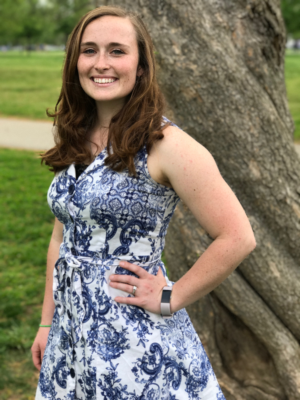 photo of Laura Nichols in front of a tree with grass in background