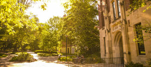 exterior of Calhoun Hall, a gray stone and red brick building