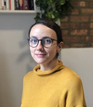 Kirsty Clark wearing a yellow sweater