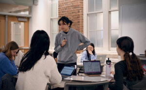 Woman teaching students