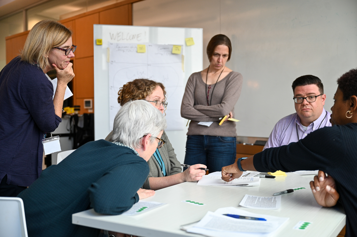 Group of people talking around table