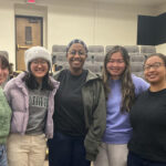 Students pose with singer Cécile McLorin Salvant.