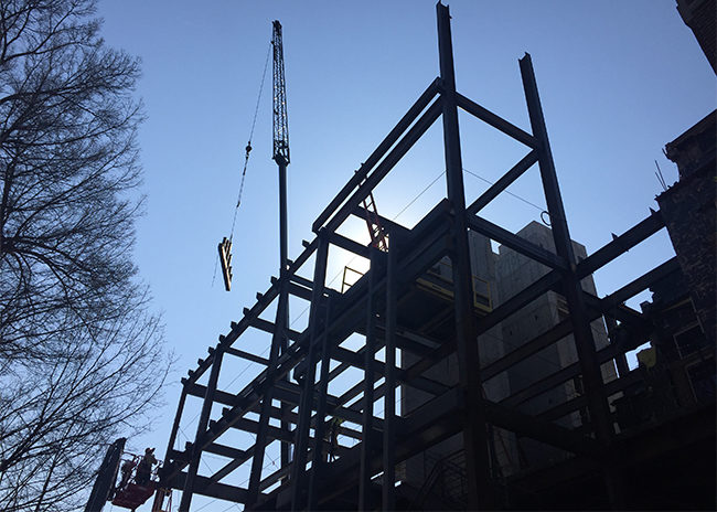 Steel frame of VUSN building at dusk
