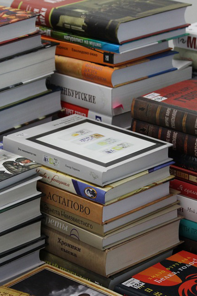 Books in a pile for Afterthoughts: Book Club, a Special Interest Group at OLLI.