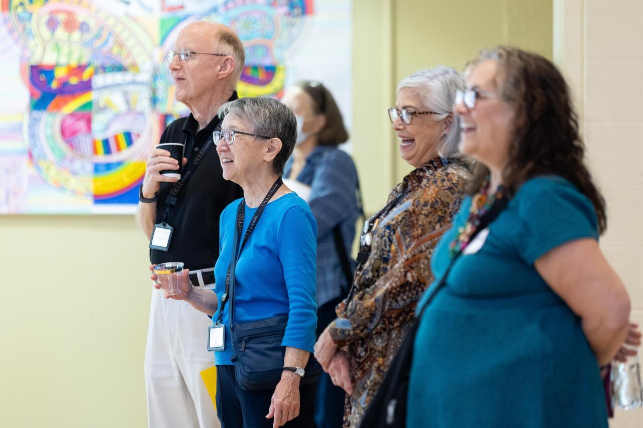 OLLI at Vanderbilt participants enjoy a presentation together at a community event.