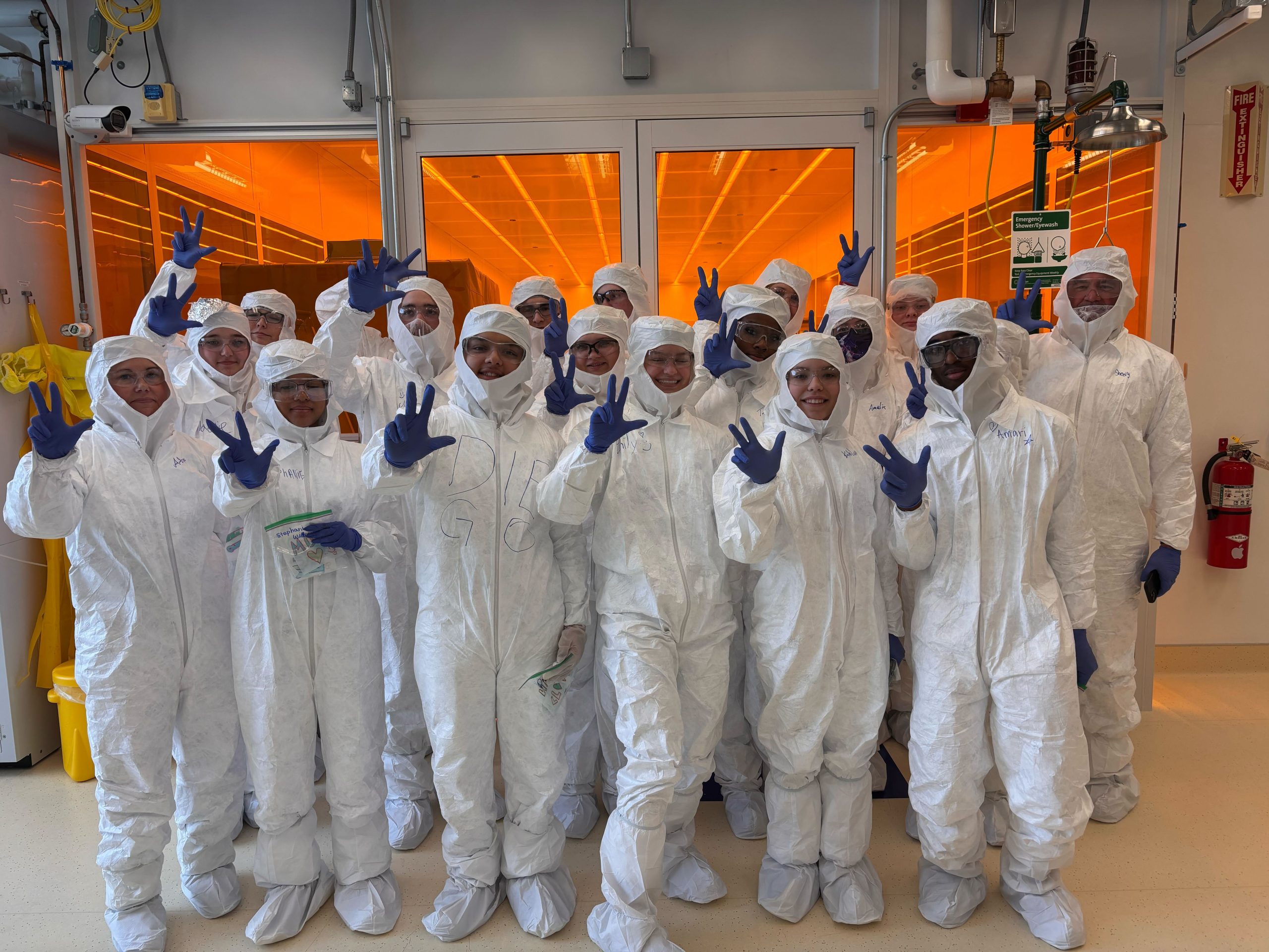 Lebanon High School students and chaperones pose in cleanroom suites during the Microfluidics Lab outreach field trip on February 12, 2026.